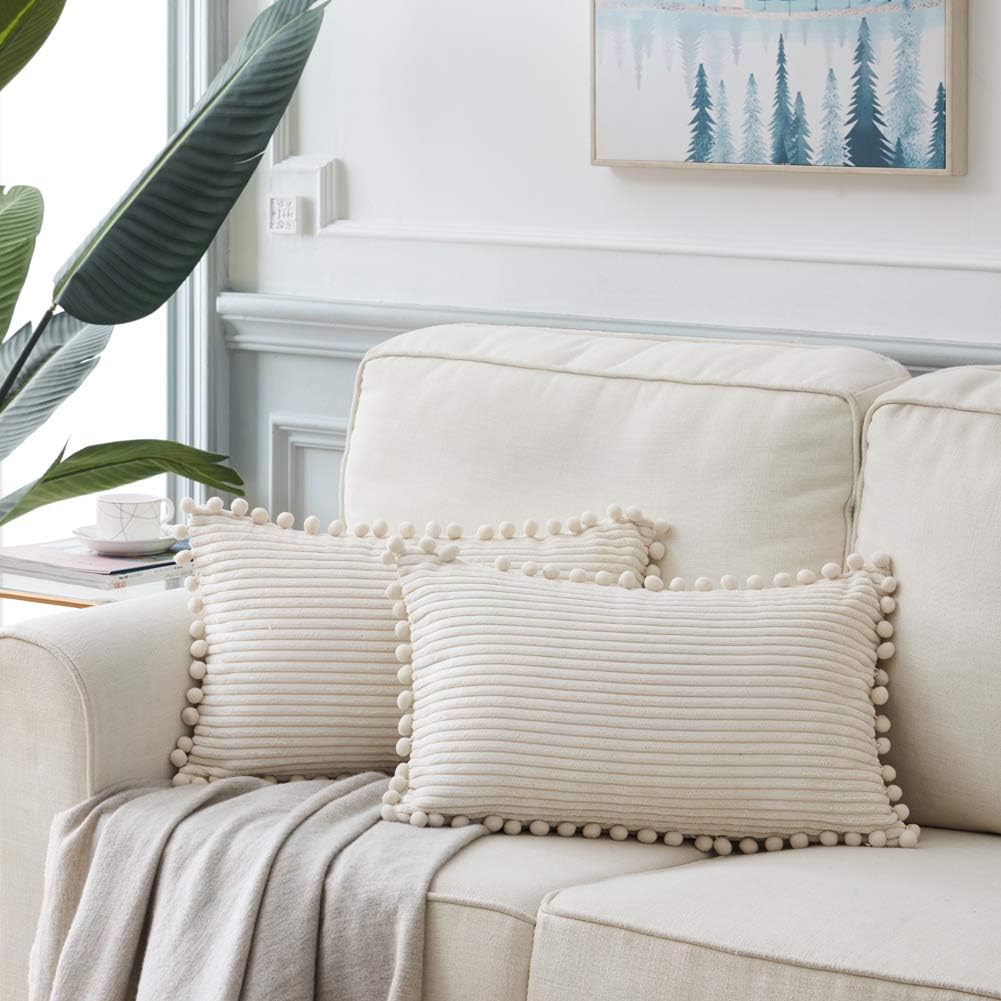 Fancy Homi Pack of 2 Boho Rectangle Decorative Throw Pillow Covers with Pom-poms, Soft Corduroy Accent Solid Cushion Case Set for Couch Sofa Bedroom Car Living Room (12x20 Inch/30x50 cm, Cream)