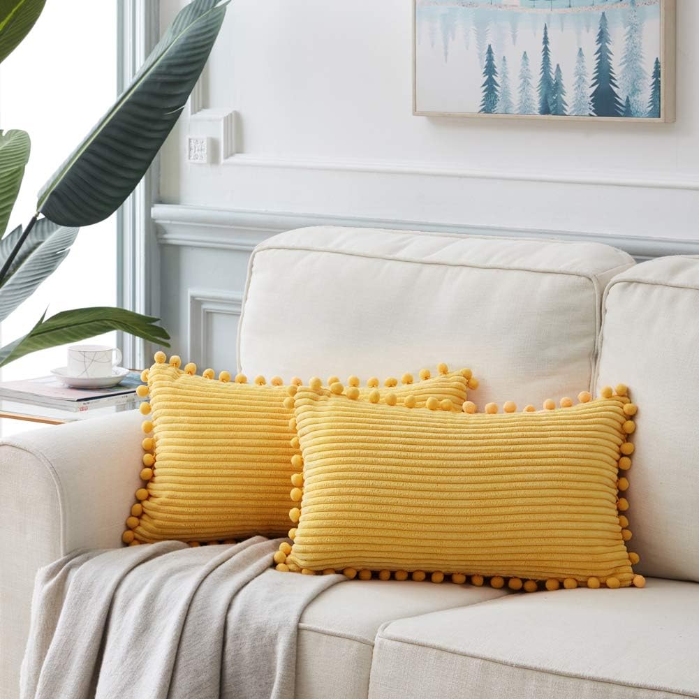 Fancy Homi Pack of 2 Boho Lumbar Decorative Throw Pillow Covers with Pom-poms, Soft Corduroy Solid Rectangle Cushion Cases Set for Couch Sofa Bedroom Car Living Room (12x20 Inch/30x50 cm, Yellow)