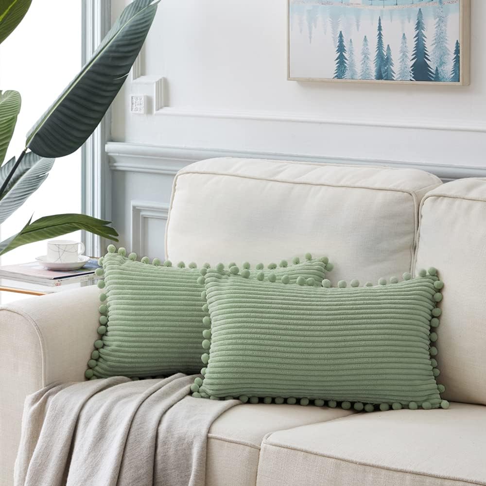 Fancy Homi 2 Pack Sage Green Lumbar Decorative Throw Pillow Covers 14x24 Inch with Pom-poms for Couch Bedroom Sofa, Farmhouse Boho Home Decor, Soft Corduroy Solid Rectangle Cushion Case 35x60 cm