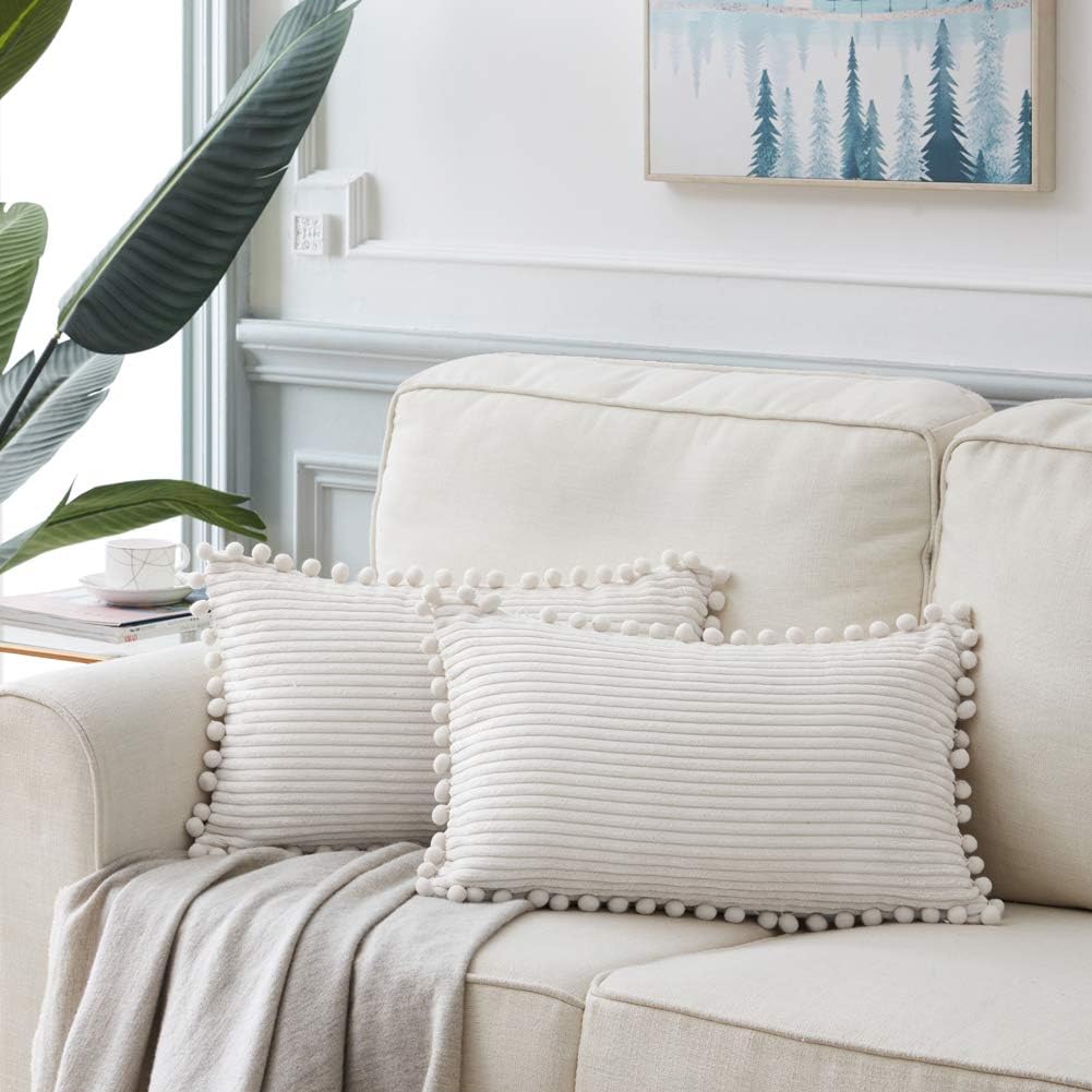 Fancy Homi 2 packs Cream White Boho Decorative Throw Pillow Covers with Pom-poms, Soft Corduroy Solid Square Cushion Cases Set for Living Room Couch Sofa Bedroom Car (14x24 Inch/35x60 cm, Cream White)